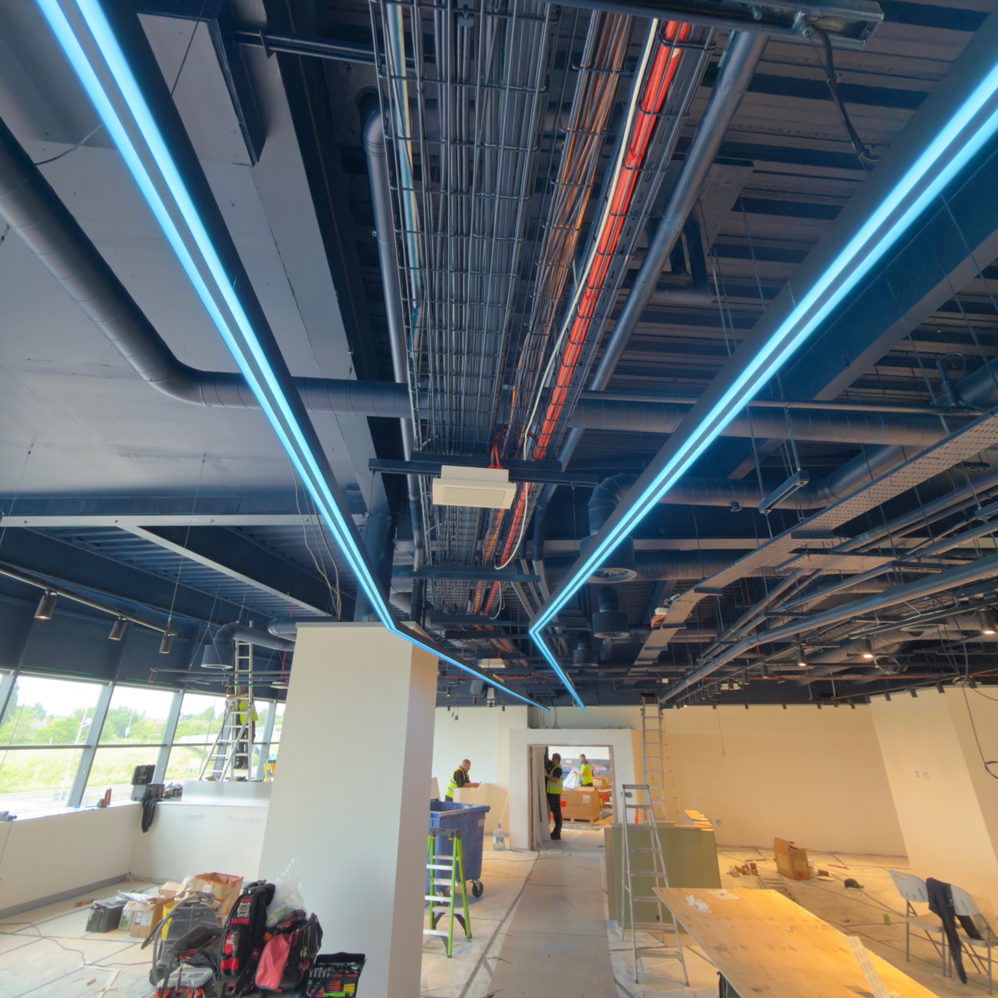 New LED tram lines and track lighting running through the store during the Coventry fit out