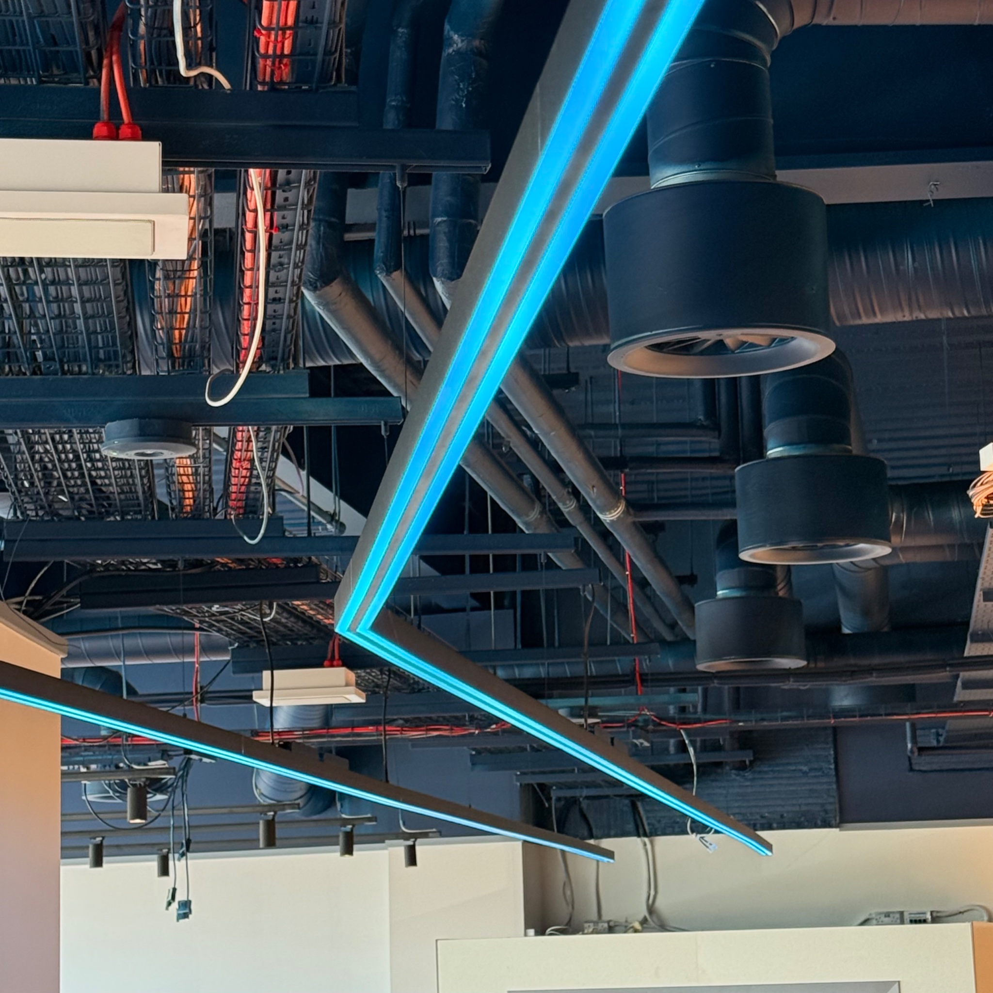 RGBW LED tram lines installed across the ceiling of a shop fit out in Coventry